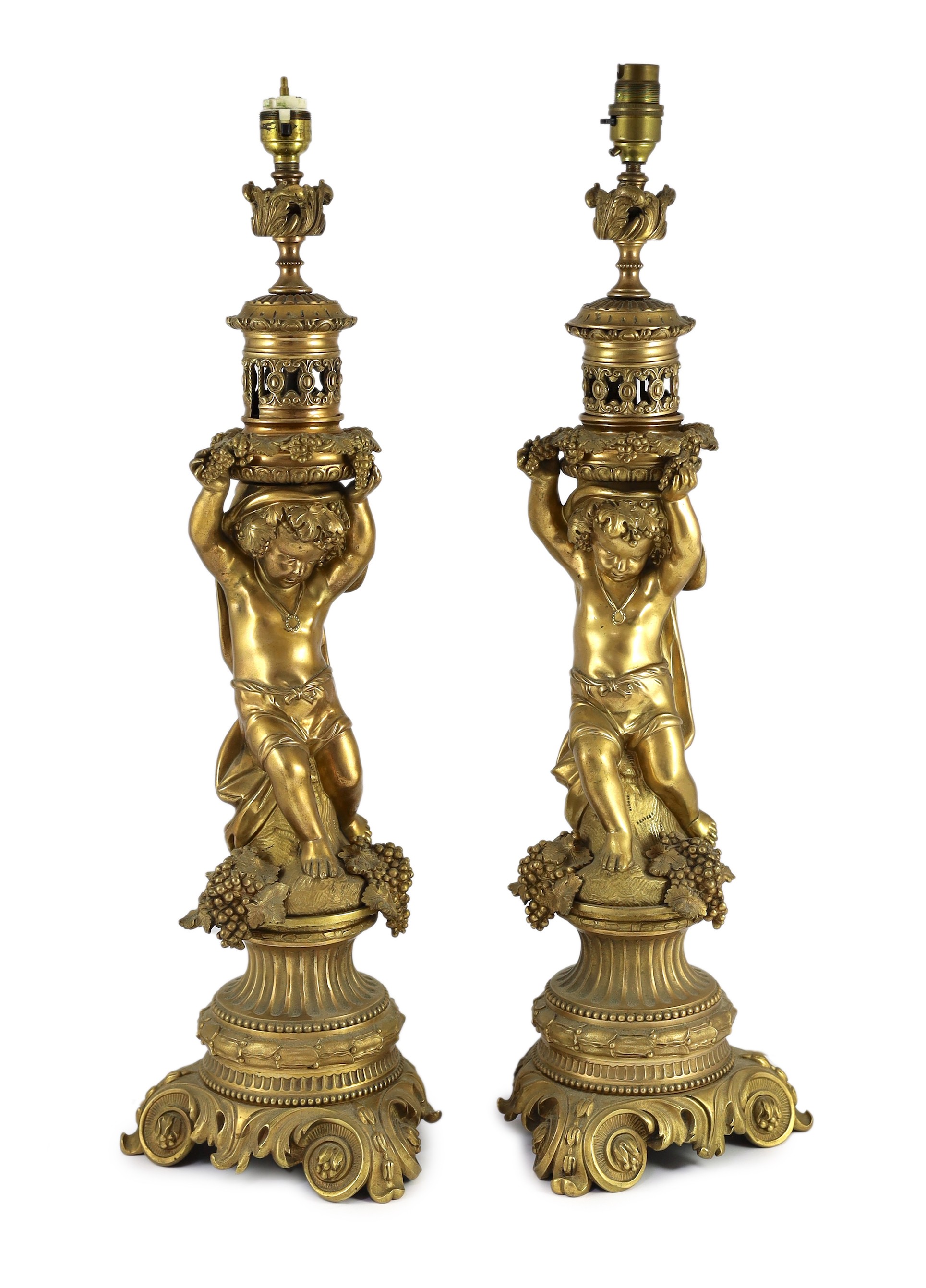 A pair of Victorian style ormolu table lamps, 50cm high to fittings